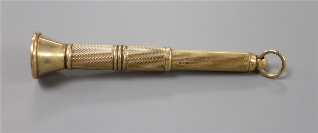 A mi 20th century engine turned 9ct gold cased cigar piercer, 67mm, gross 8.6 grams.